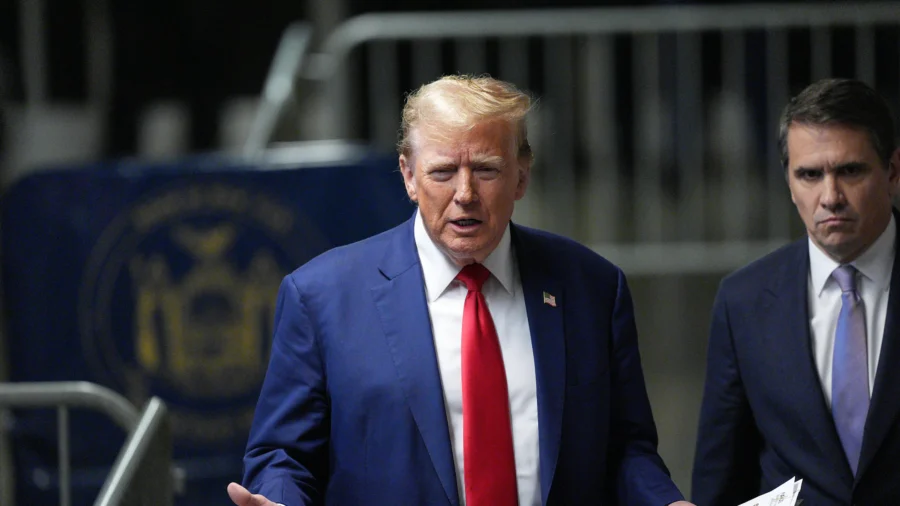 Biden Raises Cash as Trump Campaigns From Court