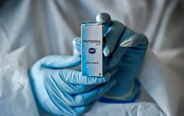 A health worker shows a box containing a bottle of Ivermectin, a medicine authorized by the National Institute for Food and Drug Surveillance (INVIMA) to treat patients with mild, asymptomatic or suspicious COVID-19, as part of a study of the Center for Paediatric Infectious Diseases Studies, in Cali, Colombia, on July 21, 2020. (Luis Robayo/AFP via Getty Images)