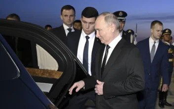 Russia's President Vladimir Putin, foreground, gets into a vehicle upon arrival at the Beijing Capital International Airport in Beijing on May 16, 2024. (Yue Yuewei/Xinhua via AP)