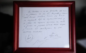 A framed copy of the napkin linking the 13-year-old Lionel Messi to FC Barcelona is seen in Barcelona, Spain, on Jan. 5, 2012. (Manu Fernandez/AP Photo)