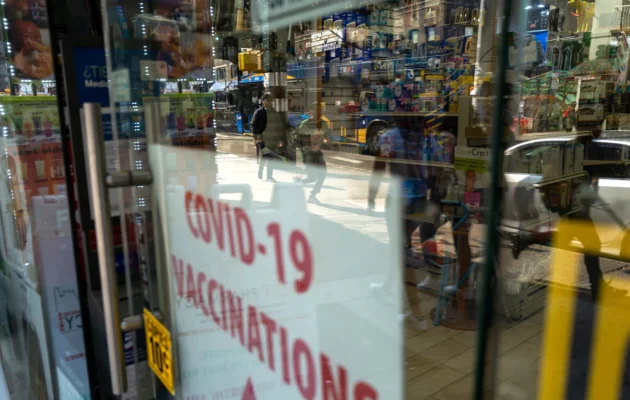 A pharmacy advertises COVID-19 vaccines in a window in the Queens borough of New York City, on May 11, 2023. (Spencer Platt/Getty Images)