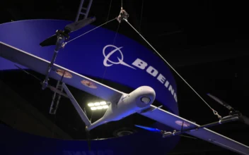 An unmanned aerial vehicle (UAV) is displayed above The Boeing Company booth at Special Operations Forces (SOF) Week at the Tampa Convention Center on May 8, 2024 in Tampa, Fla., (Luke Sharrett/Getty Images)