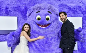 Cailey Fleming (L) and John Krasinski pose with the character "Blue" at the premiere of Paramount Pictures' "IF" at the SVA Theatre in New York, on May 13, 2024. (Evan Agostini/Invision/AP)