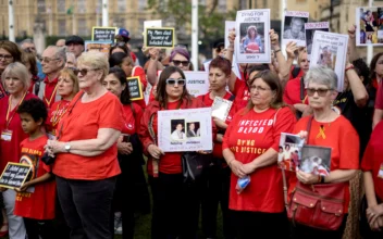 People affected by the infected blood scandal attend a vigil in Parliament Square in London, England, on May 19, 2024. (Jack Taylor/Getty Images)