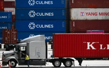 A truck driver prepares to depart with a cargo shipping container from the Port of Los Angeles in Los Angeles, Calif., on June 7, 2023. (Patrick T. Fallon/AFP via Getty Images)
