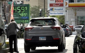 A sign displays gas prices at a gas station in Chicago on May 21, 2024. (Scott Olson/Getty Images)