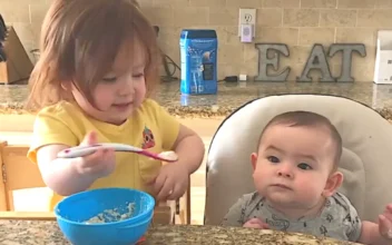Little Girl Adorably Feeds Baby Brother Spoonfuls of Oatmeal