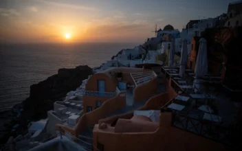 Greece Tourism: Tourists Watch the Iconic Sunset of Santorini
