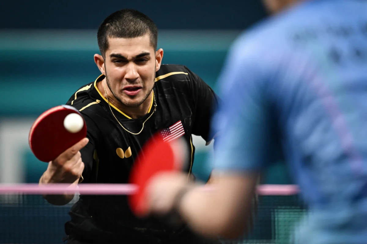 US' Kanak Jha plays against South Korea's Cho Daeseong during their men's table tennis singles round of 64 at the Olympic Games in Paris, on July 28, 2024. (Jung Yeon-je/AFP via Getty Images)