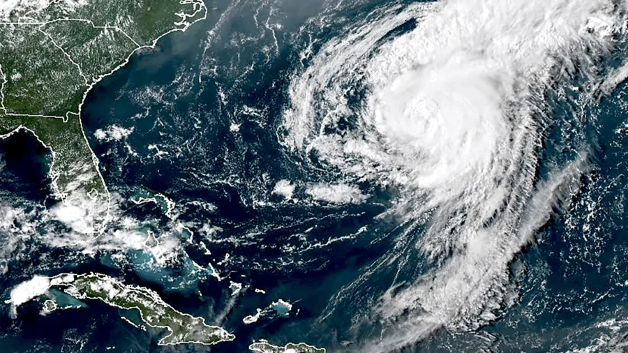 Hurricane Ernesto Weakens Into Tropical Storm as It Moves Away From Bermuda Over Open Waters