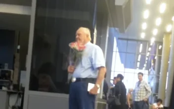 Man Waits for Wife with Flowers and Chocolates