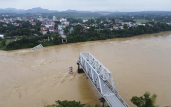 Flooding Sweeps Away Bus and Bridge Collapses in Vietnam as Storm Deaths Rise to 59