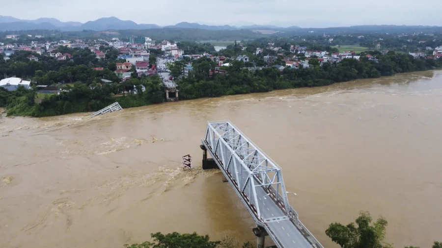 Flooding Sweeps Away Bus and Bridge Collapses in Vietnam as Storm Deaths Rise to 59