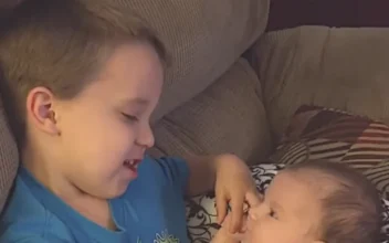 Older Brother Sings to Baby Sister