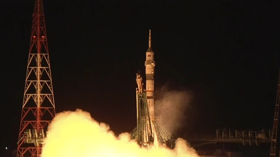 Soyuz Craft With 2 Russians and 1 American Docks at International Space Station