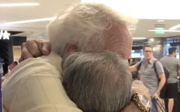 Father and Son Hug After Reuniting at the Airport