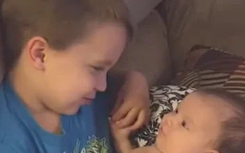 Older Brother Sings to Baby Sister