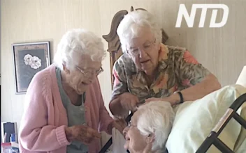 Grandmother Gets Hair Brushed by Sisters