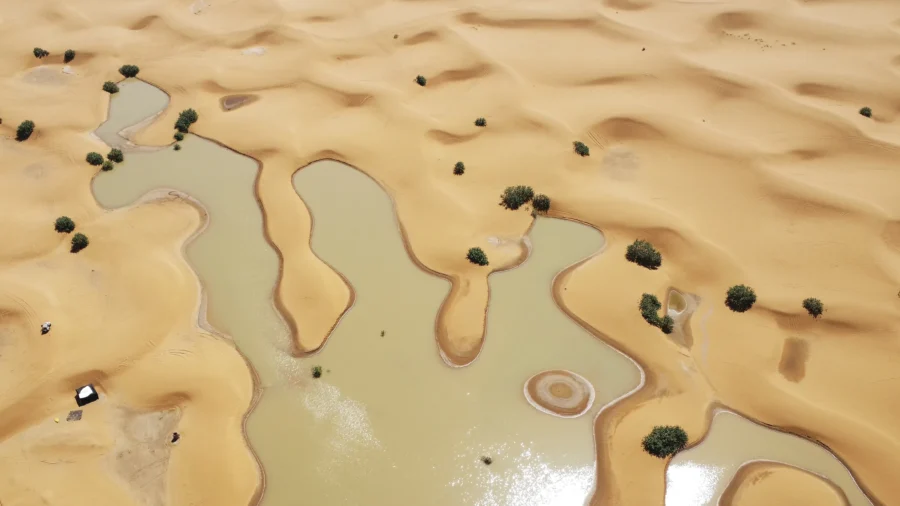 Water Gushes Through Sand Dunes After Rare Rainfall in Sahara Desert