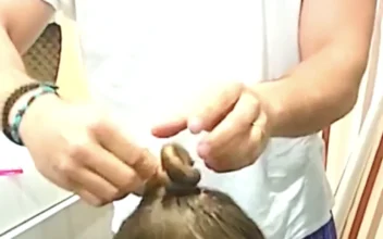 Dad Helps Daughter Create Hair Bun