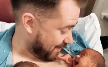 Newborn Baby Opens a Huge Smile to Greet Daddy