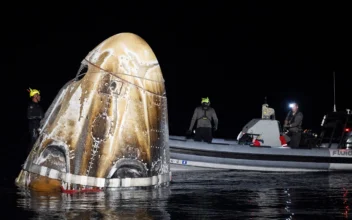 Support teams work around the SpaceX Dragon Endeavour spacecraft shortly after it landed, in the Gulf of Mexico off the coast of Pensacola, Fla., on Oct. 25, 2024. (Joel Kowsky/NASA via AP)