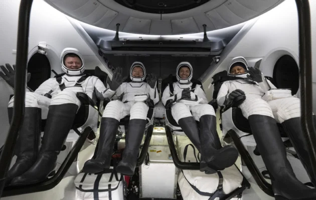 Roscosmos cosmonaut Alexander Grebenkin, (L), NASA astronauts Michael Barratt, (2nd L), Matthew Dominick, (2nd R), and Jeanette Epps, (R), inside the SpaceX Dragon Endeavour spacecraft onboard the SpaceX recovery ship MEGAN shortly after having landed in the Gulf of Mexico off the coast of Pensacola, Fla., on Oct. 25, 2024. (NASA/Joel Kowsky via AP)