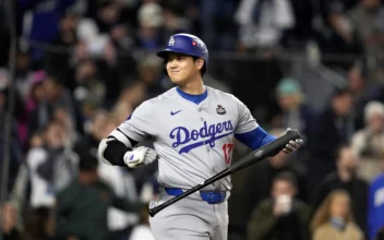 Los Angeles Dodgers' Shohei Ohtani walks to the plate to bat against the New York Yankees during the first inning in Game 3 of the baseball World Series, Monday, Oct. 28, 2024, in New York. (AP Photo/Godofredo A. Vásquez)