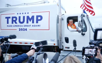 Trump Wears Hi-Viz Vest, Rides in Garbage Truck at Wisconsin Rally