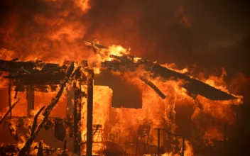 Thousands Ordered to Evacuate as Powerful Wind-Fed Wildfire Burns Homes in Southern California