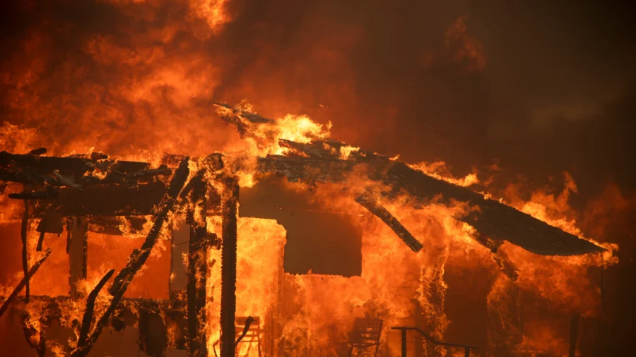 Thousands Ordered to Evacuate as Powerful Wind-Fed Wildfire Burns Homes in Southern California