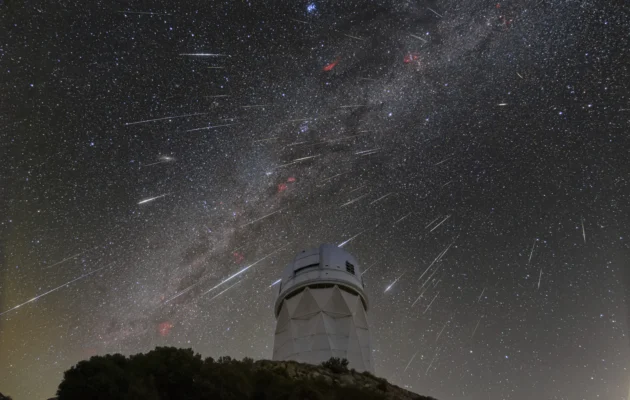 The meteors from the Geminid meteor shower streaking across the sky above the Nicholas U. Mayall Telescope at Kitt Peak National Observatory (KPNO), a Program of NSF's NOIRLab, in Tucson, Ariz., on Dec. 14, 2023. (NSF's NOIRLab via AP)