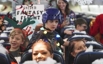 Flight Takes Children to Visit Santa at North Pole Scene in Transformed Denver Airport Hangar