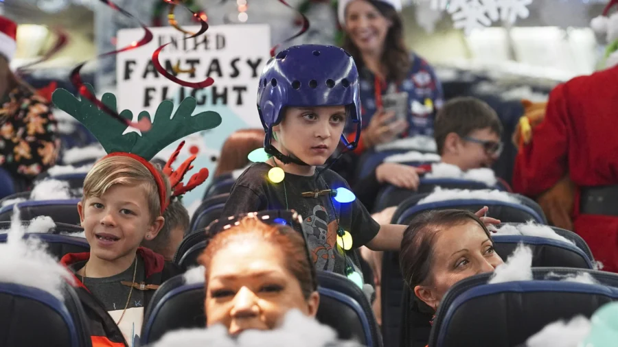 Flight Takes Children to Visit Santa at North Pole Scene in Transformed Denver Airport Hangar