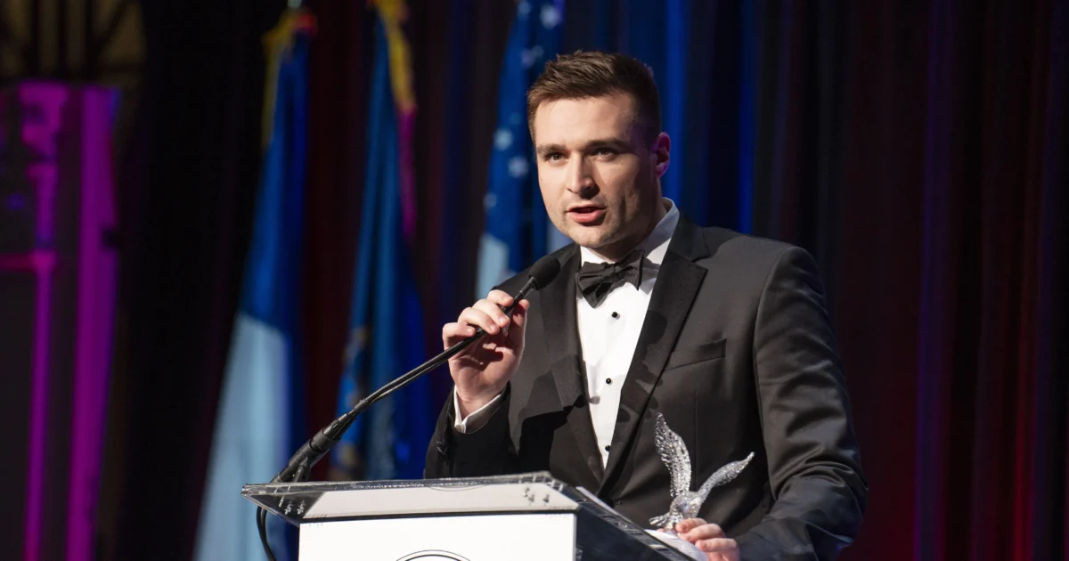 Trump Campaign Strategist Alex Bruesewitz Collapses on Stage at New