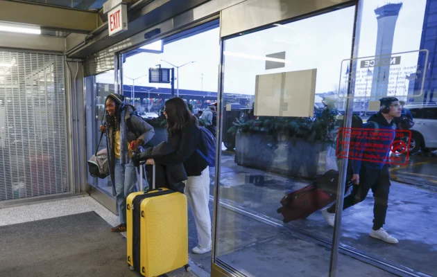 Travelers walk through O'Hare International Airport in Chicago, Ill., on Dec. 20, 2024. (Kamil Krzaczynski/AFP via Getty Images)