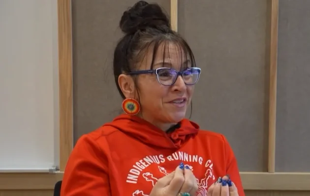 Robyn Michaud, a full-time professor and marathon runner, speaks during an interview with NTD in a still from video released on Jan. 21, 2025. (NTD)