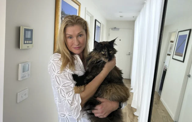Margo Neas holds her cat Mittens at her home in Melbourne, Australia, on Jan. 22, 2025. (Rod McGuirk/AP Photo)