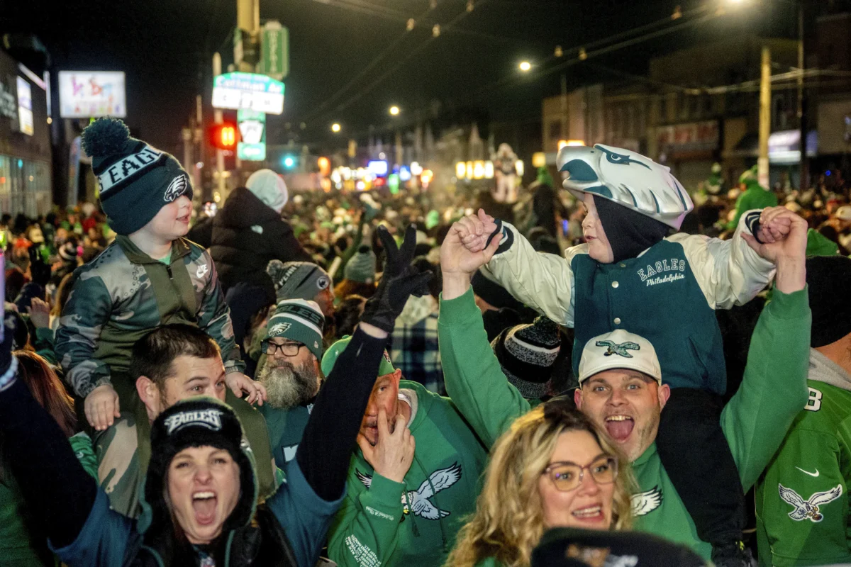 Philadelphia Eagles fans celebrate in Philadelphia after the team defeated the Washington Commanders in the NFC Championship NFL football game on Jan 26, 2025. (Tom Gralish/The Philadelphia Inquirer via AP)