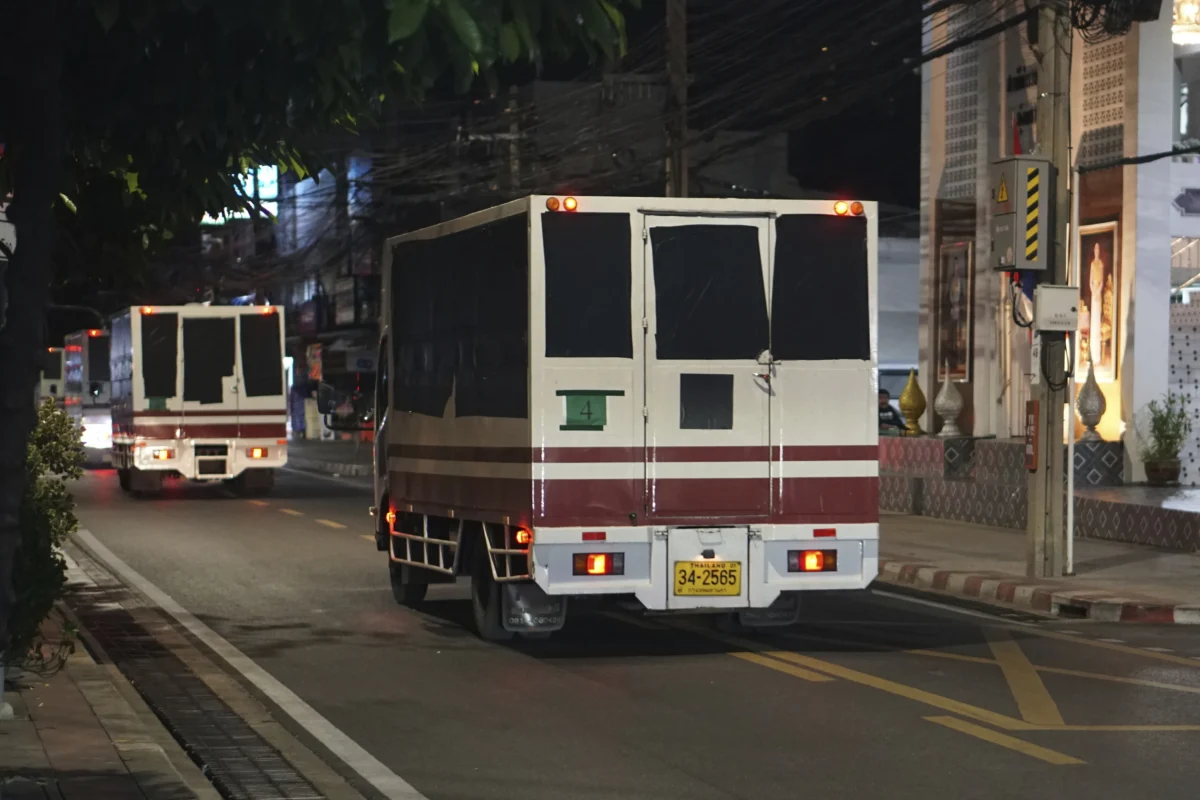 Trucks with black tape covering the windows leave a detention center in Bangkok, Thailand, on Feb. 27, 2025. (Nuttaphol Meksobhon/Prachatai via AP)
