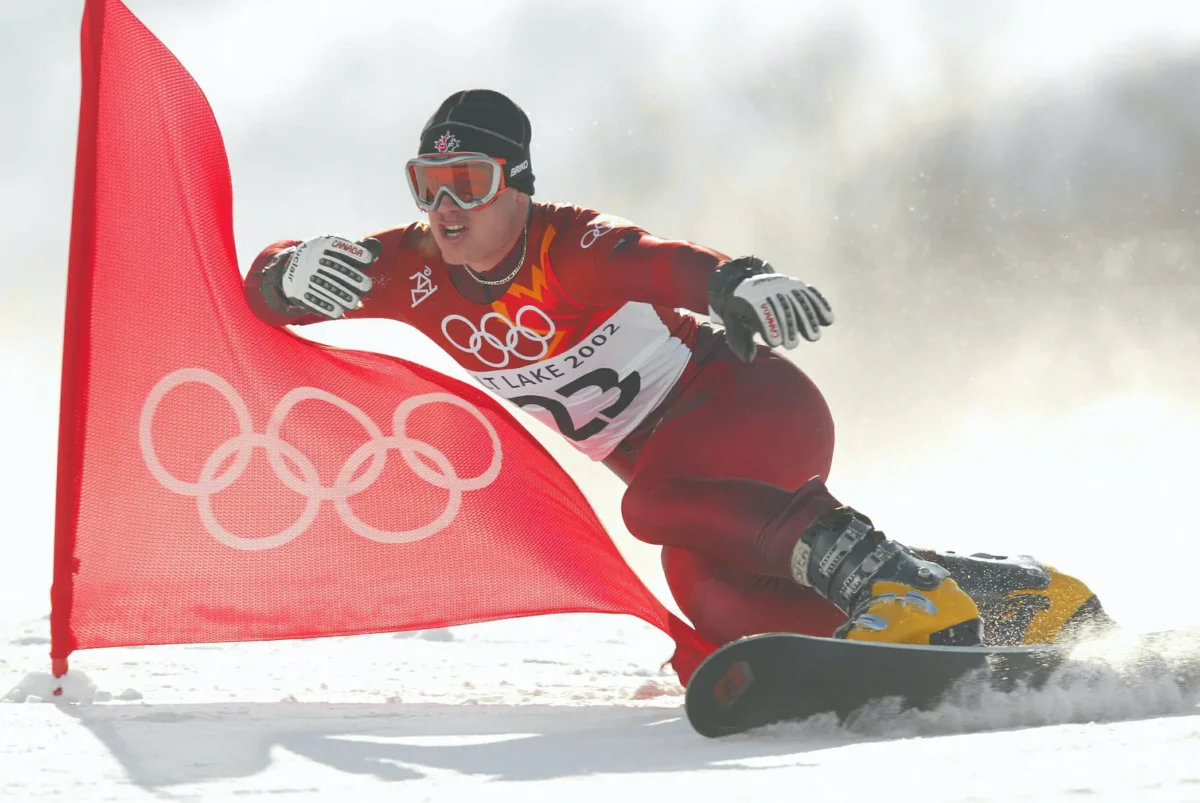 Ryan Wedding of Canada competes in the qualifying round of the men's parallel giant slalom snowboarding event during the Salt Lake City Winter Olympic Games at the Park City Mountain Resort in Park City, Utah, on Feb. 14, 2002. (Adam Pretty/Getty Images)