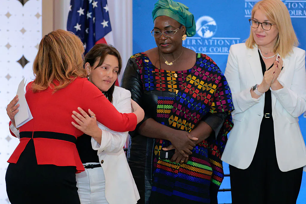 A hostage of the Oct. 7 Hamas terrorist attack in Israel, Amit Soussana (2nd L) is embraced by Global Women’s Issues Senior Bureau Official Katrina “Kat” Fotovat after Soussana, human rights defender Henriette Da of Burkina Faso (C) and Romanian mental health advocate Georgiana Pascu all received the International Women of Courage Award during a ceremony with first lady Melania Trump in the Ben Franklin Room at the State Department's Harry S. Truman headquarters in Washington on April 1, 2025. (Chip Somodevilla/Getty Images)