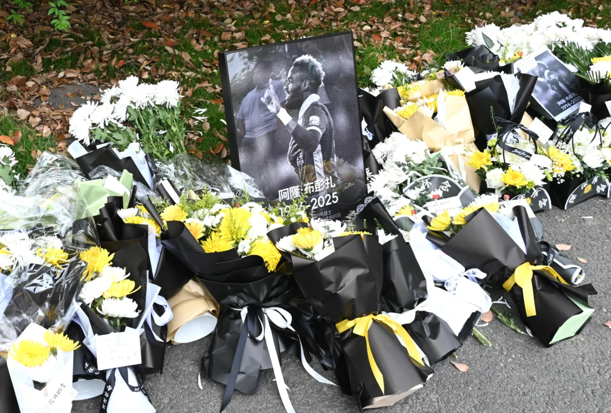 A makeshift memorial site for Gabon international striker Aaron Boupendza outside Zhejiang FC's headquarters in Hangzhou, China's eastern Zhejiang province on April 17, 2025. (AFP via Getty Images)