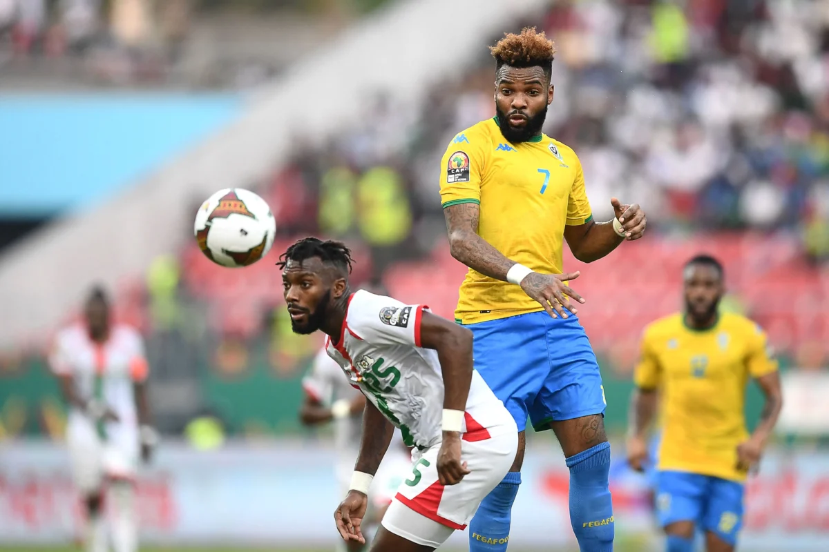 Gabon's forward Aaron Boupendza (R) fights for the ball with Burkina Faso's defender Steeve Yago during the Africa Cup of Nations (CAN) 2021 round of 16 football match between Burkina Faso and Gabon at Limbe Omnisport Stadium in Limbe on Jan. 23, 2022. (Charly Triballeau/AFP via Getty Images)