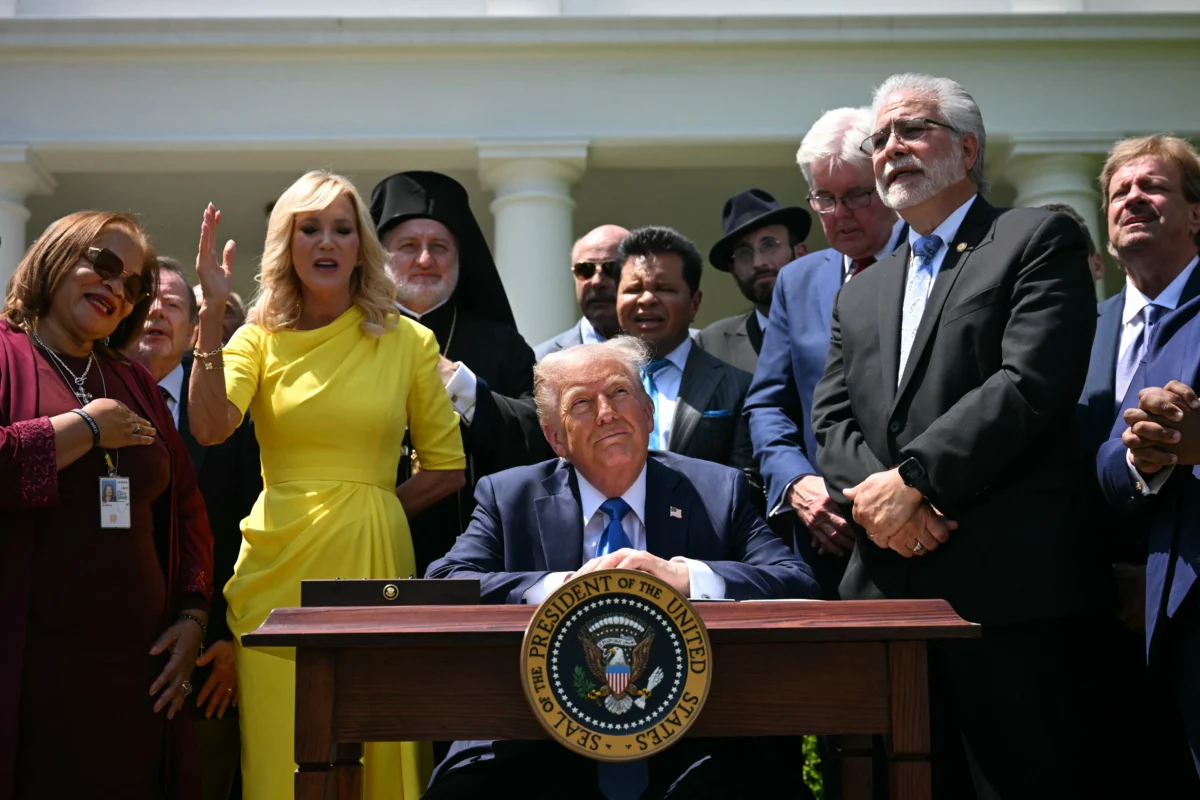 Rev. Paula White (2nd L) and other faith leaders pray behind President Donald Trump during a National Day of Prayer event in the Rose Garden of the White House on May 1, 2025. (Jim Watson/AFP via Getty Images)