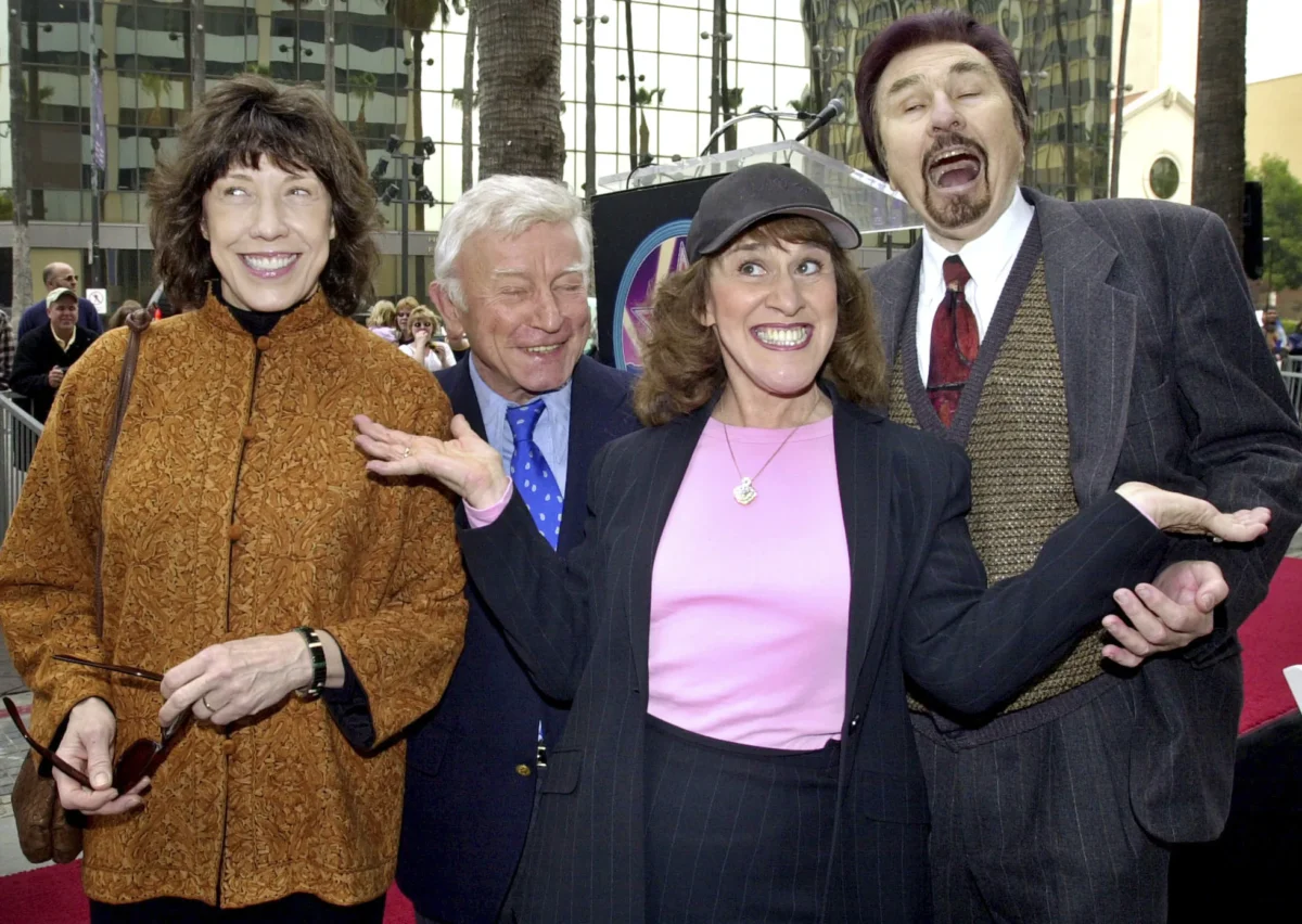 (L–R) "Rowan & Martin's Laugh-In" cast members Lily Tomlin, Henry Gibson, Ruth Buzzi, and Gary Owens pose for the media in the Hollywood section of Los Angeles on April 2, 2002. (Nick Ut/AP Photo)