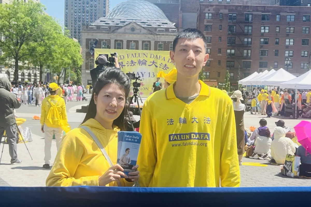 Sand Zhu and his wife at Union Square in New York City on May 11, 2025. (Zhao Fenni/The Epoch Times)