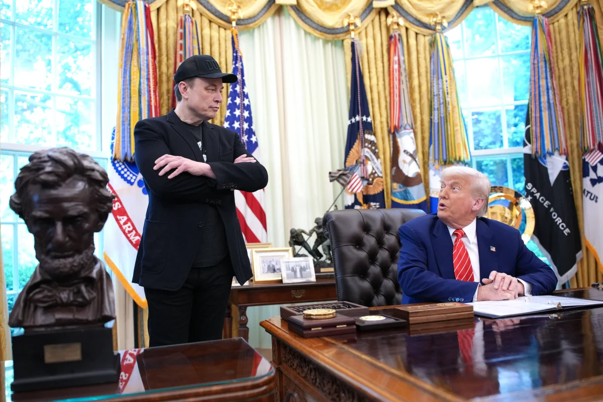 President Donald Trump, joined by Tesla CEO Elon Musk (L), speaks to reporters in the Oval Office of the White House on May 30, 2025. (Kevin Dietsch/Getty Images)