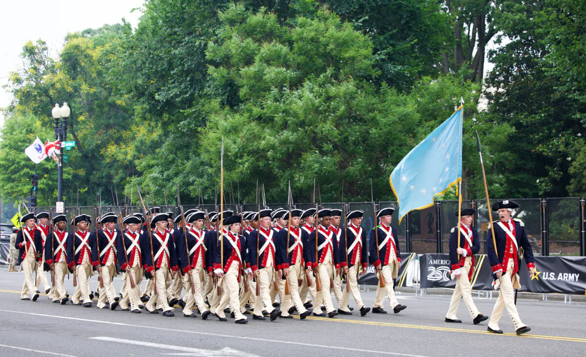 U.S. military service members in Revolutionary War uniform march along Constitution Avenue during the Army 250th Anniversary Parade in Washington on June 14, 2025. (Amid Farahi/AFP via Getty Images)