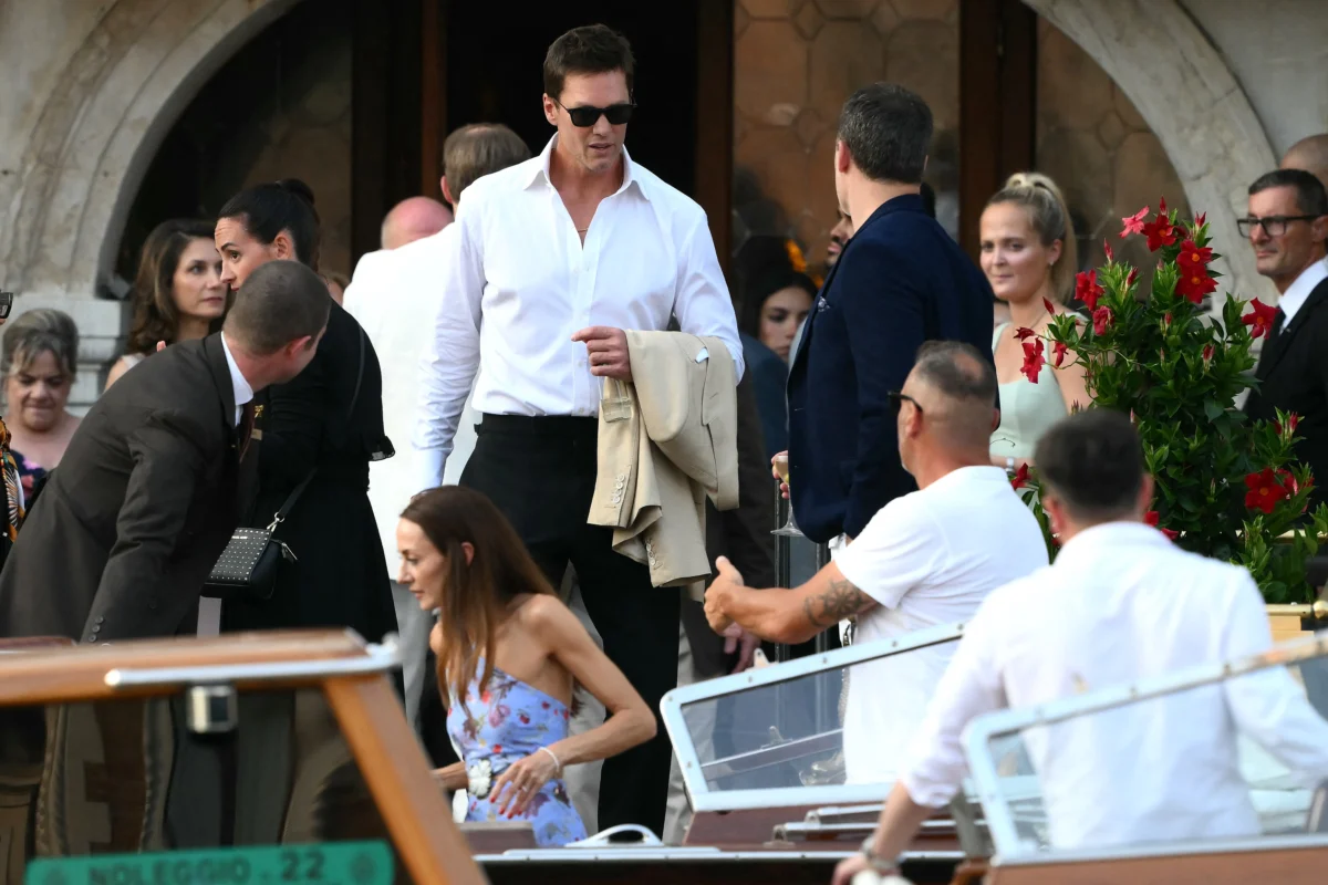 Tom Brady gets on a taxi boat at the Gritti Palace Hotel ahead of the wedding of Amazon's founder Jeff Bezos with Lauren Sanchez, in Venice, Italy, on June 26, 2025. (Marco Bertorello/AFP via Getty Images)